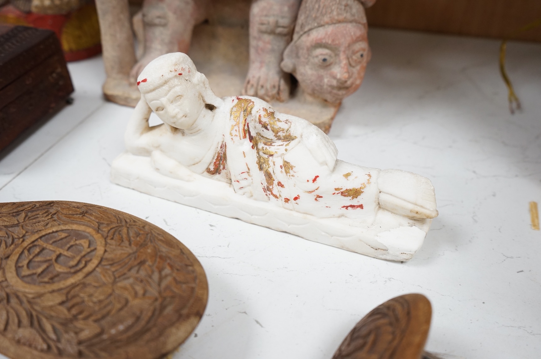 Eight south-east Asian carvings and a mounted bone, tallest 43cm